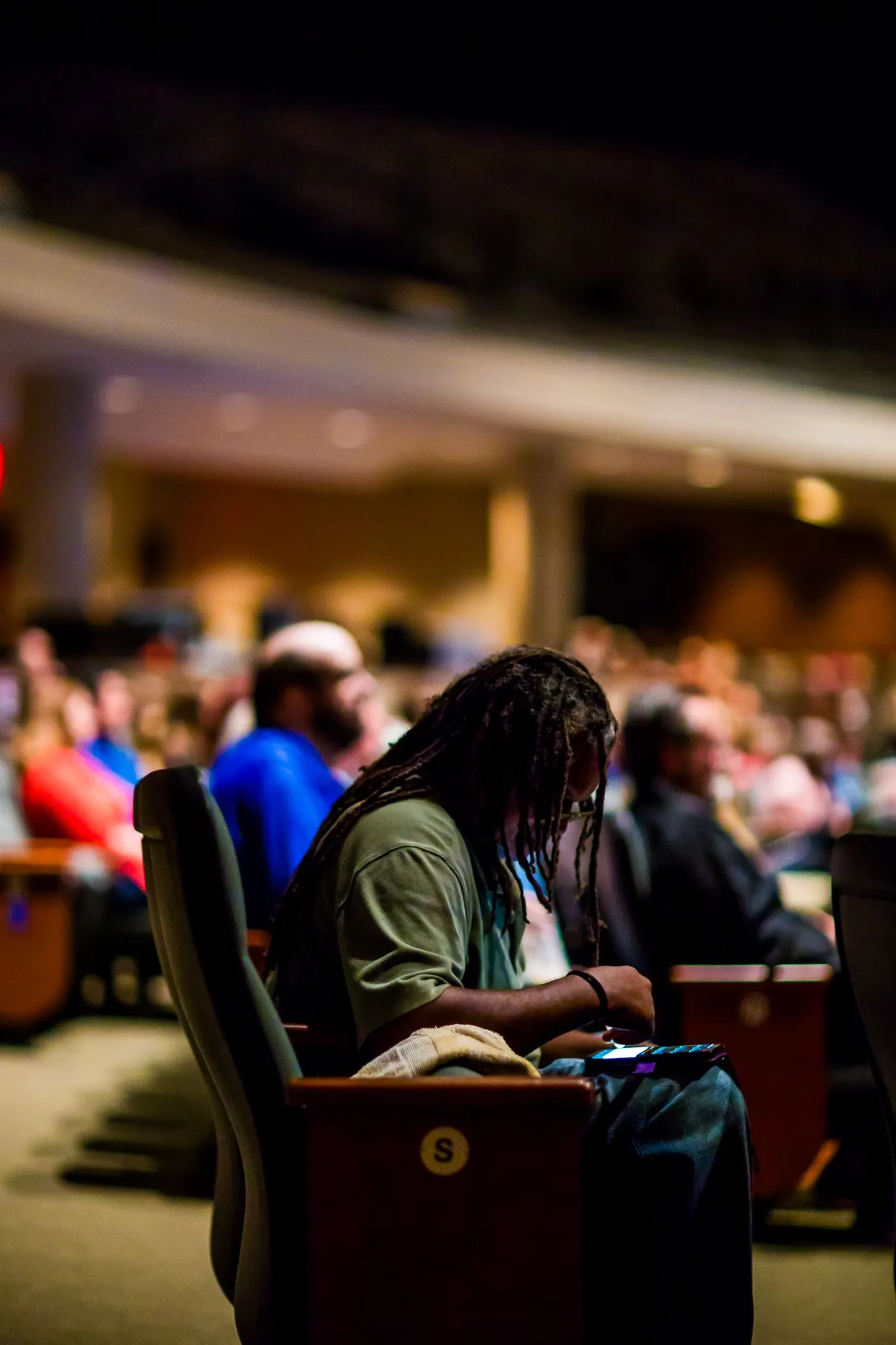 Attendees seated together in a conference auditorium